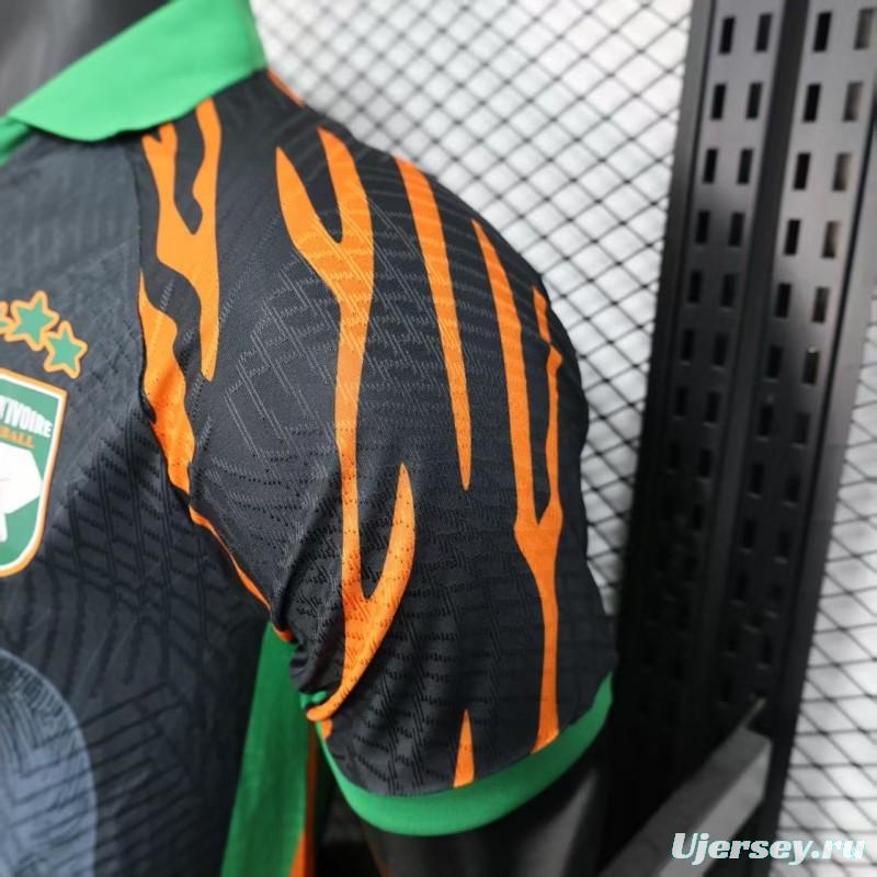 Player Version 2025 Ivory Coast Black with Elephant Graphic and Orange Stripes Jersey